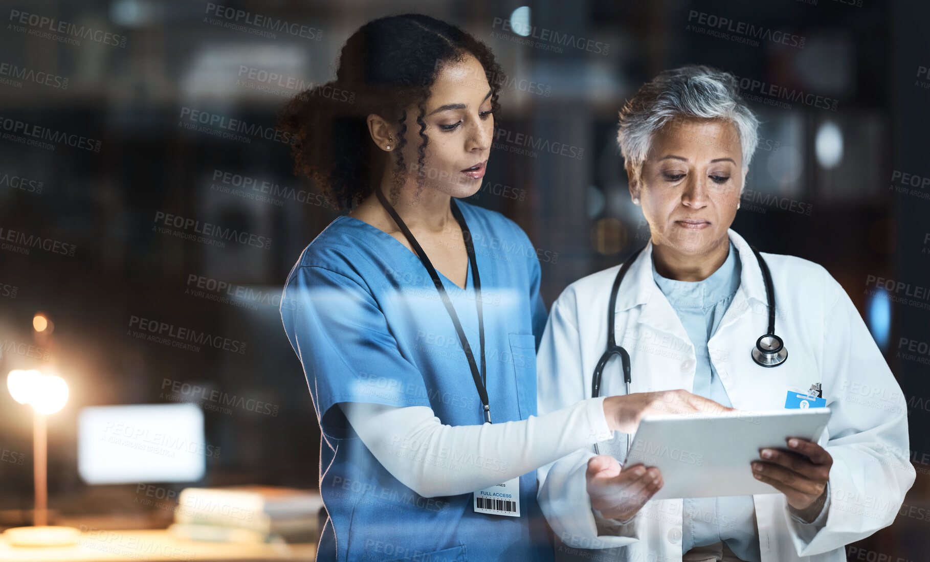 Buy stock photo Doctors, nurse and digital tablet for night teamwork, medical research and surgery planning in wellness hospital. Talking, healthcare and worker women in collaboration on technology for late thinking