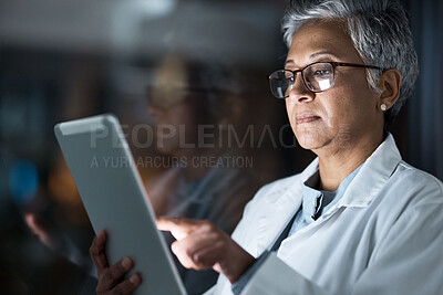 Buy stock photo Medical, research and night with doctor and tablet for planning, medicine and schedule. Technology, review and digital with senior woman reading report for healthcare, science and life insurance news