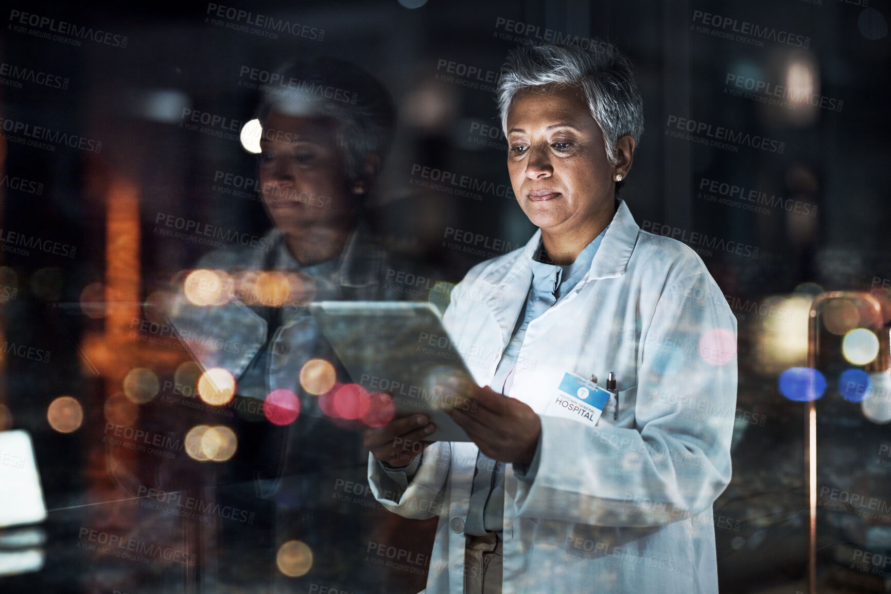 Buy stock photo Medical, research and night with doctor and tablet for planning, medicine and schedule. Technology, review and digital with senior woman reading report for healthcare, science and life insurance news