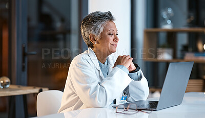 Buy stock photo Doctor, laptop and senior woman in hospital working late or overtime on email, telehealth or research. Elderly, health and female medical physician reading healthcare information at night on computer