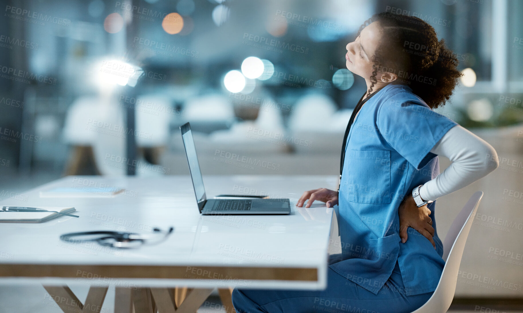 Buy stock photo Laptop, back pain and doctor in her office at the hospital working on a diagnosis or cure. Computer, healthcare and female medical worker with a muscle sprain, ache or inflammation at medicare clinic