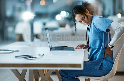 Buy stock photo Back pain, stress and doctor in her office at the hospital working on a diagnosis or cure. Computer, healthcare and female medical worker with a muscle sprain, ache or inflammation at medicare clinic