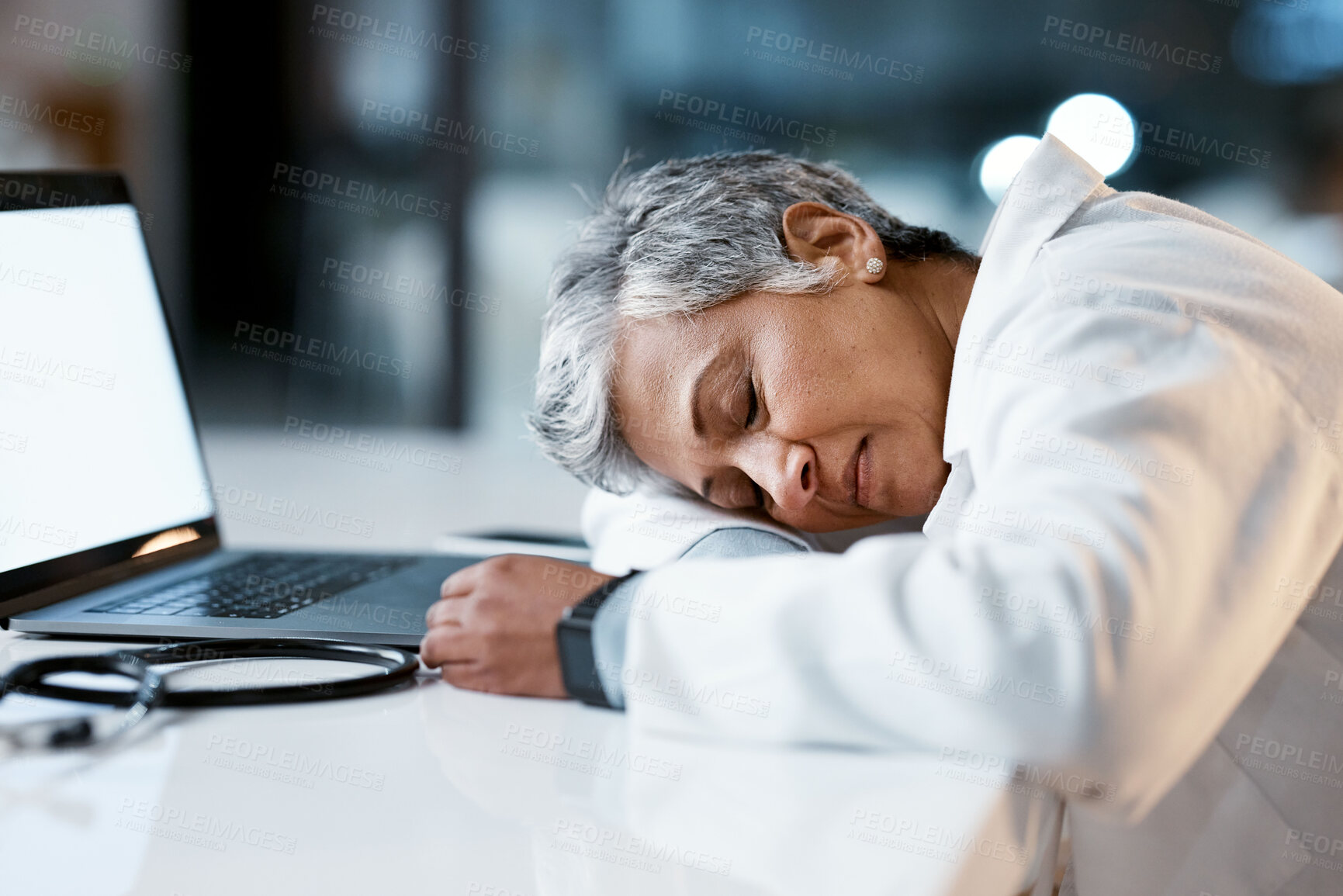 Buy stock photo Healthcare, overtime and doctor sleeping at laptop, burnout and exhausted from research with mockup. Stress, sleep and woman in medicine at desk, tired and napping at work late at night in hospital.