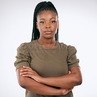 Buy stock photo Black woman, arms crossed and standing isolated on gray background for confident profile or empowerment. Portrait of African American female model with serious face for leadership or management