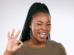 Portrait, ok sign and black woman with smile, confident and achievement with girl on studio background. Face, African American female and happy lady with good news, celebration or success on backdrop