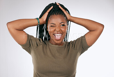 Buy stock photo Comic, funny and black woman with a crazy face isolated on a grey studio background. Smile, happy and African girl model with tongue sticking out for comedy, happiness and goofy on a backdrop