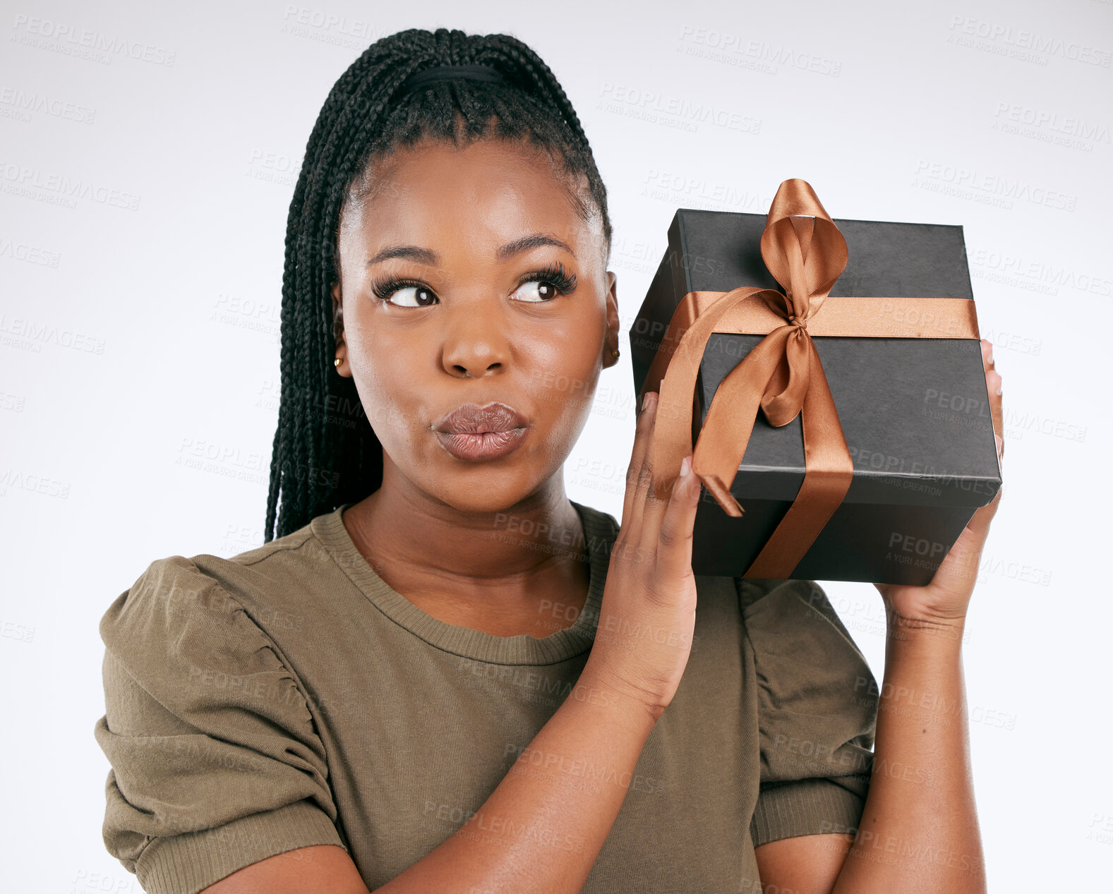 Buy stock photo Box, gift and black woman wonder in studio of package, excited girl and celebration. Curious female, present and surprise for ribbon, background and thinking of birthday giveaway of product promotion