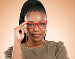 Black woman in portrait with face, holding glasses with vision and prescription lens isolated on studio background. Eyewear, eye care and health, smart girl with red fashion frame and optical mockup