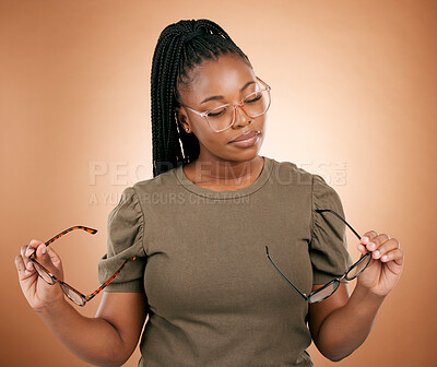 Buy stock photo Woman, studio and choose glasses for eyecare, health and vision for thinking, beauty and decision. African model, choice and fashion spectacles for optometry, wellness and frame design by background