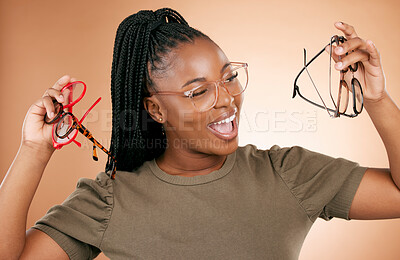 Buy stock photo Excited, glasses frame choice and black woman with a smile from eye care and retail product. Studio background, isolated and beauty of a young student feeling happiness about vision product shopping