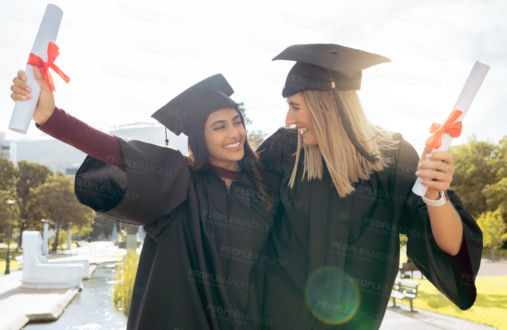 Buy stock photo Graduation, celebration and friends with diploma, success and pride. Happy women, graduate students and certificate of study goals, target award and smile of education, motivation and winning outdoor