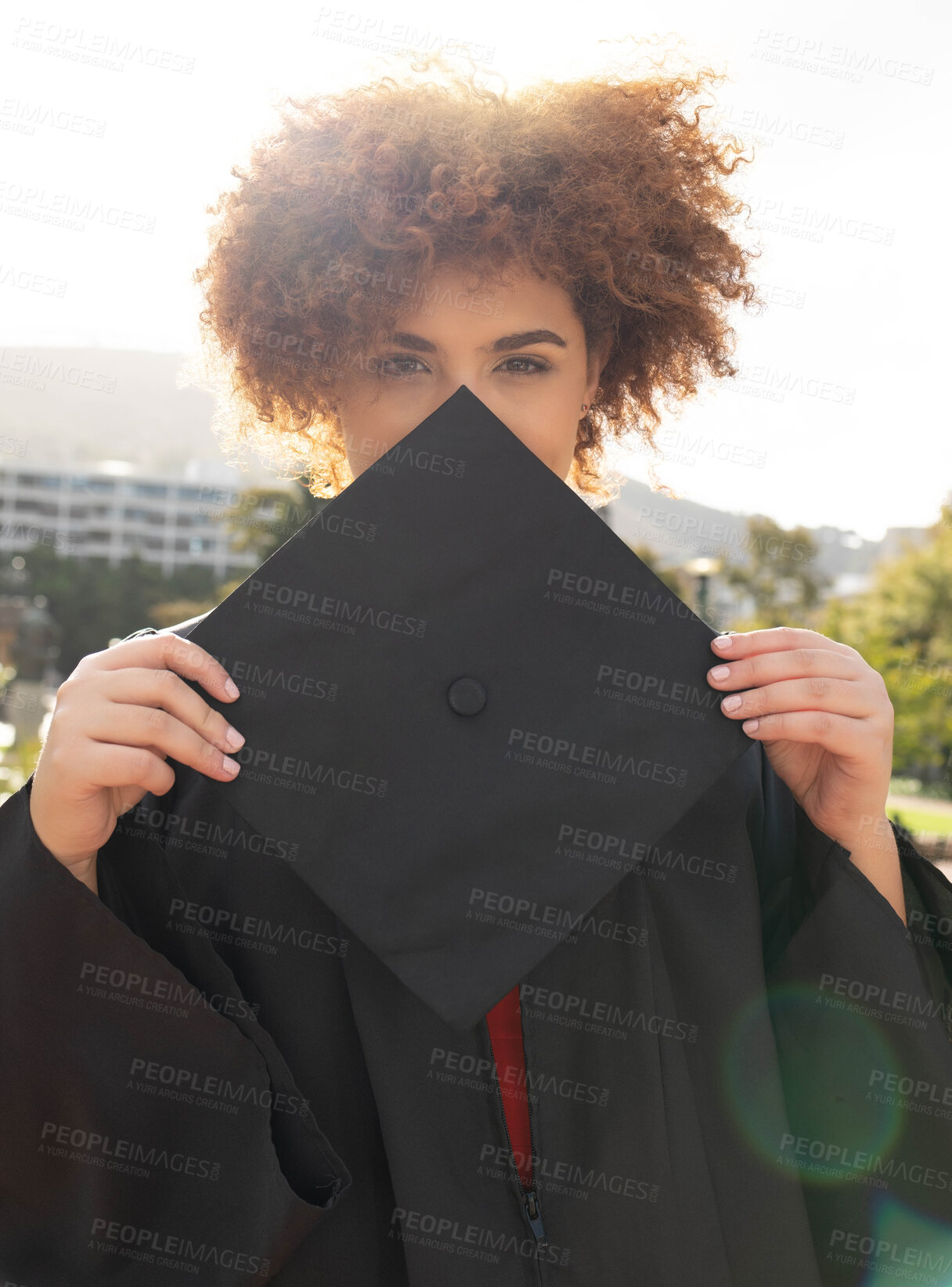 Buy stock photo University student girl, portrait and graduation cap to hide face with success, achievement and goal. Black woman, graduate celebration and vision in education, learning and future career in sunshine