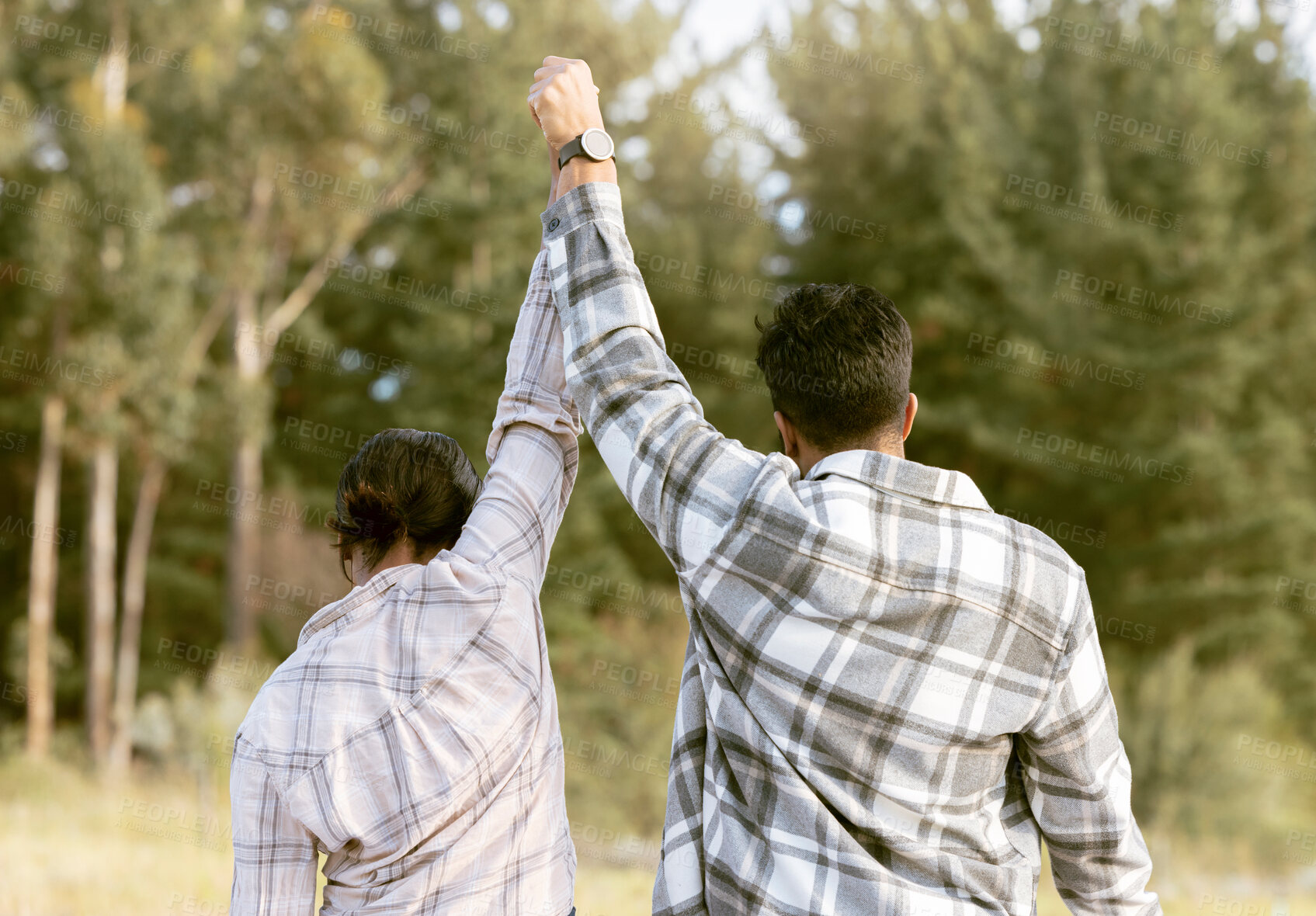 Buy stock photo Success, hiking and back of couple holding hands in forest for achievement, victory or fitness goals. Travel, freedom and man with woman celebrating milestone, journey and adventure goal in nature