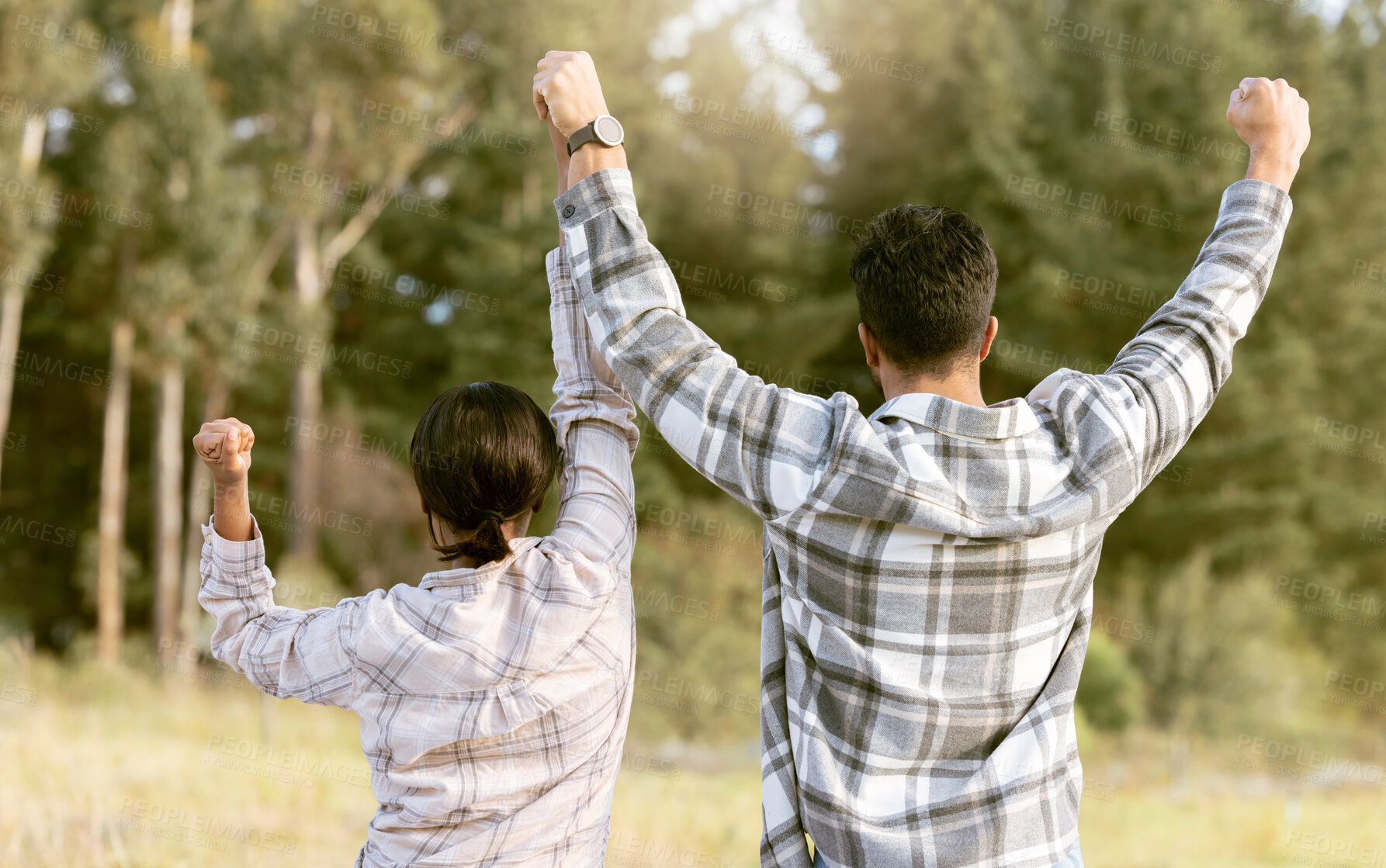 Buy stock photo Back, hiking and couple holding hands for success, victory and achievement, fitness and goals in forest. Rear view,  freedom and man with woman celebrating milestone, journey and adventure in nature