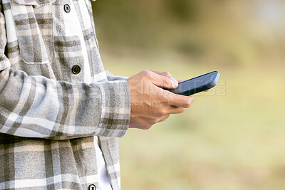 Buy stock photo Phone outdoor, man hands and park of a person typing on social media and mobile communication. 5g connection, website and media technology scroll of a male reading with blurred background in nature