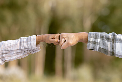 Buy stock photo Hands, fist bump and friends in agreement, deal or collaboration on mockup blurred background. Hand of people touching fists in team building, support or partnership for victory, unity or community