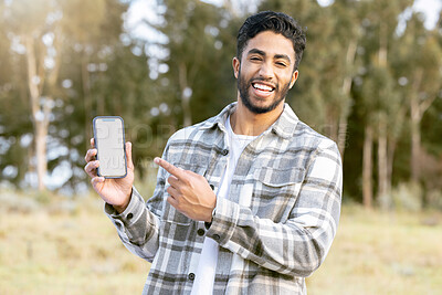 Buy stock photo Mockup, phone and portrait of man in nature or forest with mobile app, product placement or 5g technology promotion. Happy person, hand holding smartphone and space, mock up and screen in a park