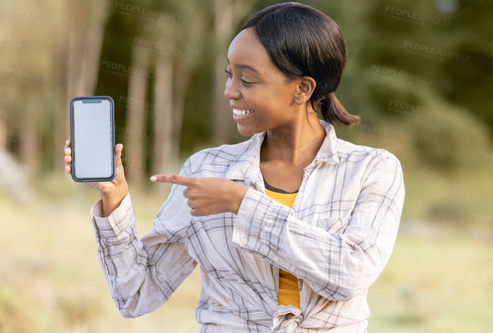 Buy stock photo Mockup screen, phone and black woman pointing at digital marketing, branding or advertising content. Outdoor, technology and person point with happiness and online on mobile with blurred background 