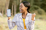 Black woman, phone and mockup display for winning, discount or sale with smile in nature. Happy African American female smiling for giveaway prize, deal or achievement on smartphone in the outdoors