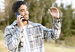 Phone call, man and relax while in a park for walking, calm and smile against a tree background. Smartphone, conversation and handsome male enjoying a walk in nature while talking, looking and fun