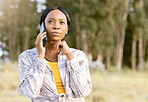 Black woman, phone and thinking on call in nature for communication, travel or cellular 5G service outdoors. African American female contemplating trip, traveling or decision on smartphone