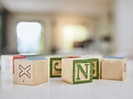 Wood blocks, table and letters for learning, education or childhood development at home. Colorful wooden cube toys to learn numbers or alphabet for back to school, spelling or mathematics to read