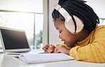 Education, black girl and writing with headphones, homework and learning for growth, happy and notes. African American female child, kid or young person with focus, development or knowledge with book