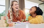 Laugh, child development and interracial family in a home learning in a living room with drawing. Parent love, funny joke and mother care with girl together in a house with study game and toys 