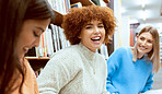 Friends, women and students in library, conversation or happiness while studying together, floor or focus. Female academics, girls or ladies with higher education, learning or ready for exams or test