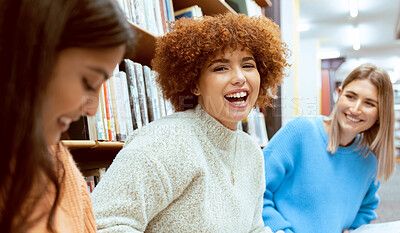 Buy stock photo Friends, women and students in library, conversation or happiness while studying together, floor or focus. Female academics, girls or ladies with higher education, learning or ready for exams or test