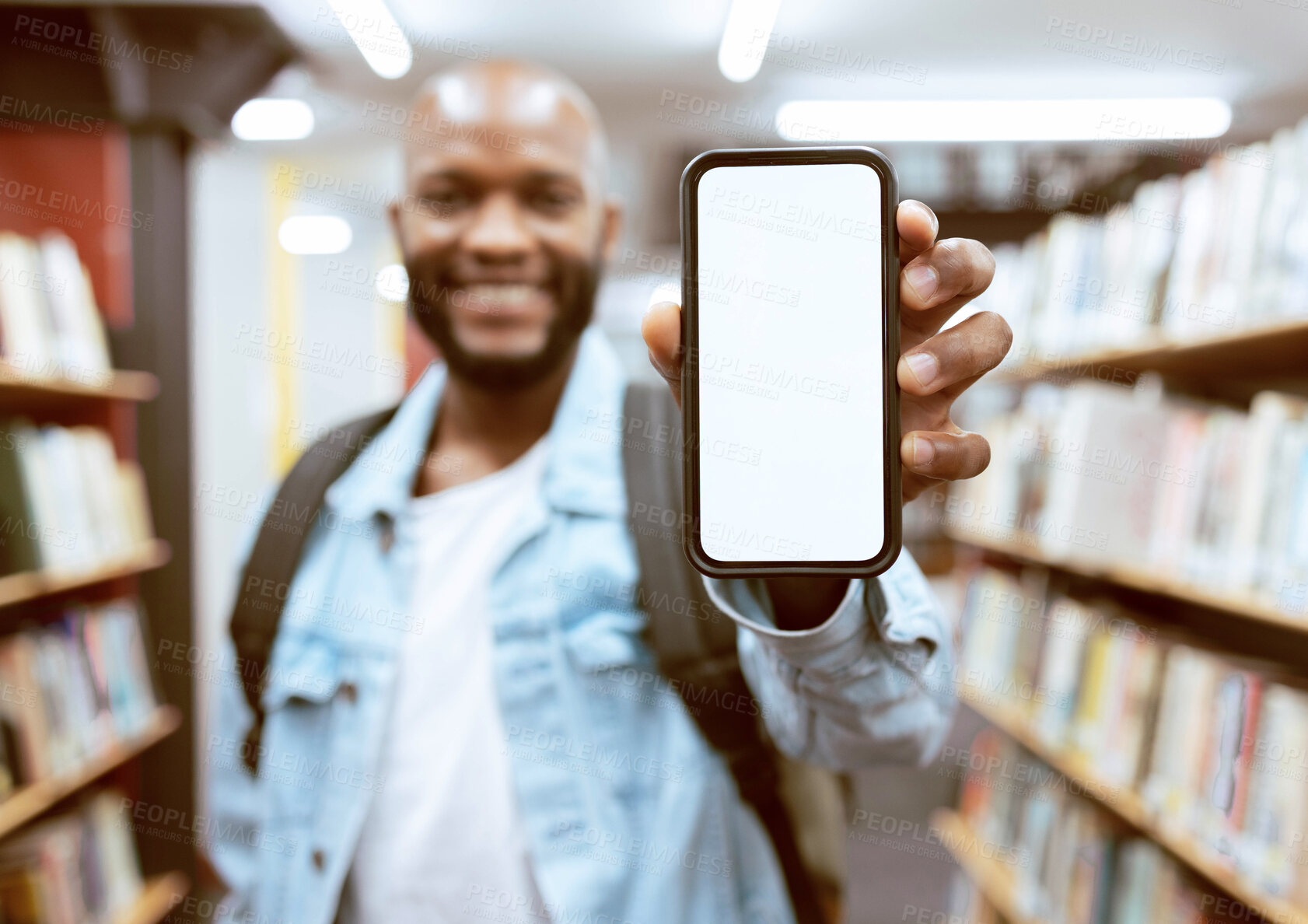 Buy stock photo Mockup screen, education or black man with phone in library for research, advertising or project management. Smile, happy or university student with tech for learning, scholarship study or web search