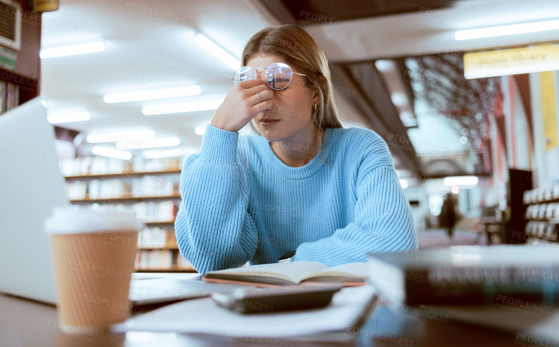 Buy stock photo Woman student, fatigue with headache and university burnout, stress for paper deadline or study for exam in library. Campus, college and tired studying with scholarship problem and mental health pain