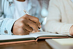 Closeup, black man hand and writing in notebook at desk for studying, planning and support for goals. Student men, book and pen for brainstorming, vision or thinking together for university success