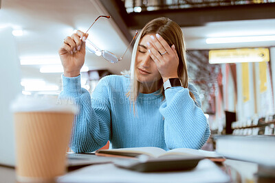 Buy stock photo Woman student, tired with headache and university burnout, stress about paper deadline or study for exam  in library. Campus, college studying fatigue with scholarship problem, pain and mental health