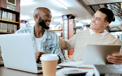 Buy stock photo Students, men and library with study support at desk with laptop, tablet and happy for learning opportunity. Student friends, laugh together and vision for university success, diversity and teamwork