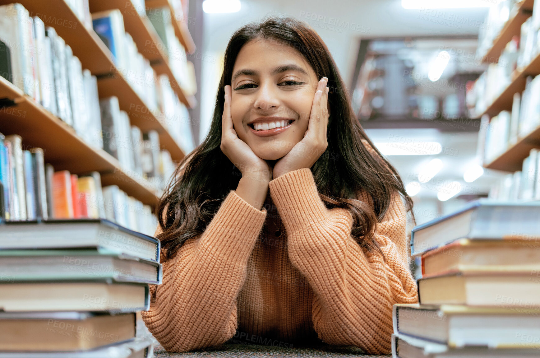 Buy stock photo Indian woman, portrait and library for studying, higher education or knowledge for exam, test or learning. Hobby, female student or academic with books, relax or college for scholarship or university