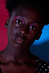 Trendy, aesthetic and portrait of black woman in dark color lighting isolated on a studio background. Neon, art and face of an African girl with creativity, makeup and stylish on a creative backdrop