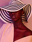 Model, design and black woman fashion in neon, UV and purple light in studio background wearing a sun hat. Style, makeup and beauty by female with dark skin aesthetic creativity and color