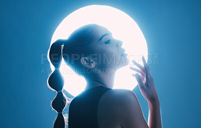 Buy stock photo Magical, beautiful and face of a girl with lighting isolated on a dark background in a studio. Idea, creative and woman thinking of futuristic glow from light, art and cosmetics on a backdrop