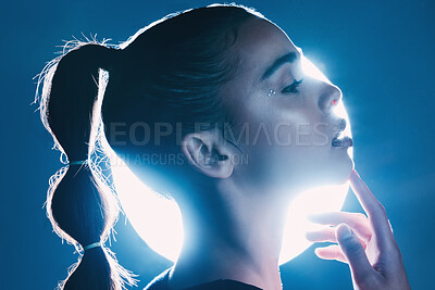 Buy stock photo Makeup, cyberpunk and face of a girl with lighting isolated on a dark background in a studio. Idea, creative and woman thinking of futuristic glow from light, art and cosmetics on a backdrop