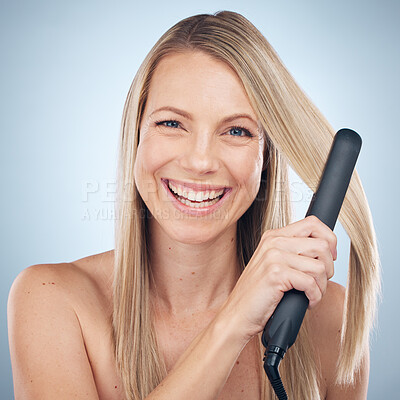 Buy stock photo Face, hair straightener and beauty portrait of woman in studio isolated on gray background. Balayage, haircare and happy female model with flat iron product for hairstyle, grooming or salon treatment