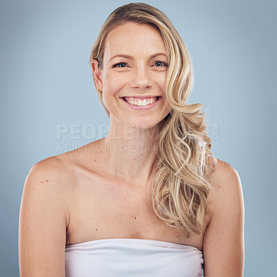 Buy stock photo Portrait, skincare and happy with a model woman in studio on a gray background for natural treatment. Face, beauty and smile with an attractive young female posing to promote a cosmetic product