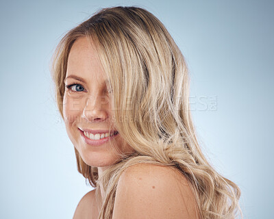 Buy stock photo Portrait, hair and happy with a model woman in studio on a gray background for keratin treatment. Face, haircare and smile with an attractive young female posing to promote natural beauty or skincare