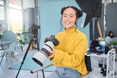 Buy stock photo Happy, photoshoot and portrait of a photographer with a camera for production, video and media. Creative, smile and an Asian woman in a studio for filming, shooting and working in photography