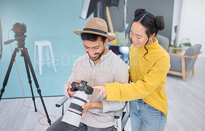 Buy stock photo Photography, photographer and model in discussion with a camera choosing a image from the photoshoot. Creative, art and young cameraman talking to woman to choose the best picture in artistic studio.
