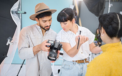 Buy stock photo Makeup artist, photographer and model checking pictures during artistic, process and glamour shooting in studio. Man, photography and lady coworking on creative, project and magazine cover together