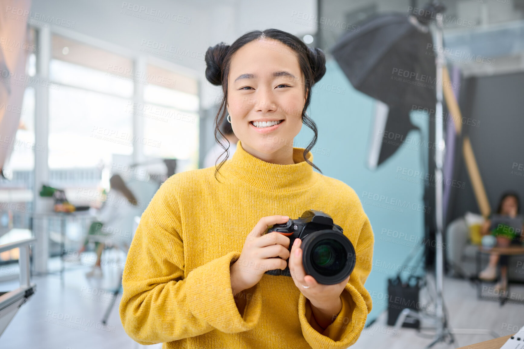 Buy stock photo Smile, camera and portrait of a photographer working at a studio for a photoshoot. Happy, media and creative Asian woman shooting, filming or learning about photography production as a career