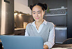 Office, laptop and corporate woman is working at her workplace for company growth strategy or project and typing online. Employee, worker or Asian receptionist at work doing research for the business