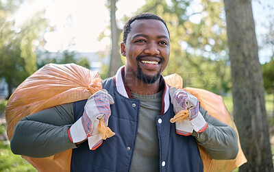 Buy stock photo Volunteer, community service and black man cleaning park with garbage bag for a clean environment. Person helping with trash or garbage for eco friendly lifestyle and recycling outdoor in nature