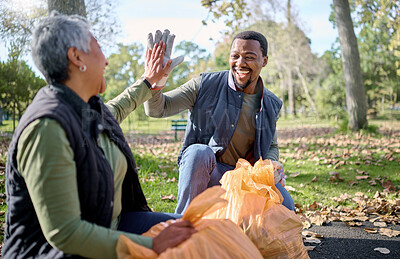 Buy stock photo High five, volunteer cleaning and people celebrate cleaning garbage, pollution or waste product for environment support. Community, NGO charity and eco friendly team help with nature plastic clean up